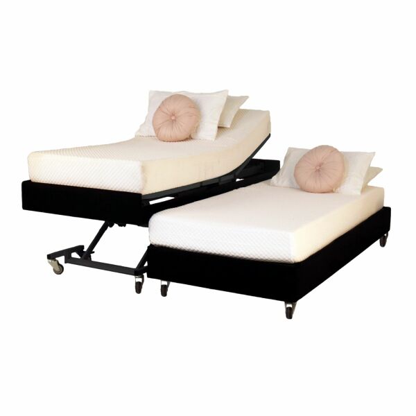 Two adjustable beds with white mattresses and pink pillows on a white background