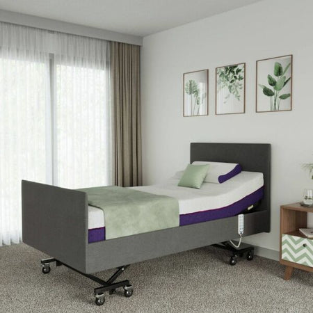 Ergonomic bed in a room with light walls and a window.