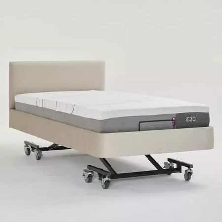 Mattress on a bed frame with 'IC30' branding on a white background