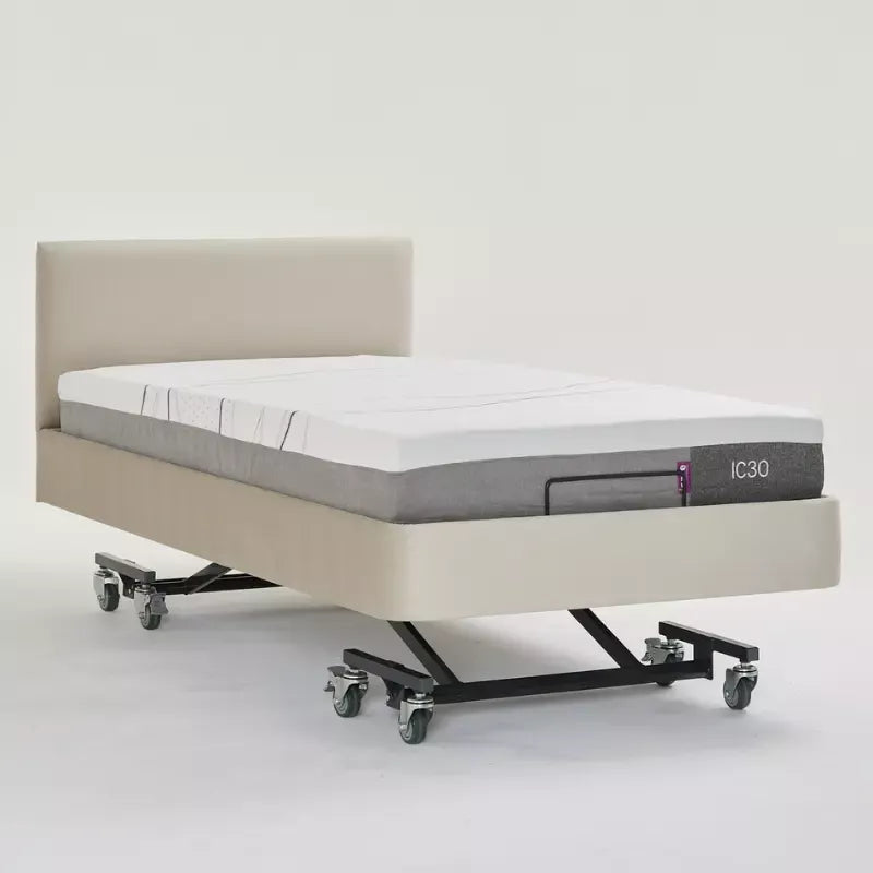 Mattress on a bed frame with 'IC30' branding on a white background
