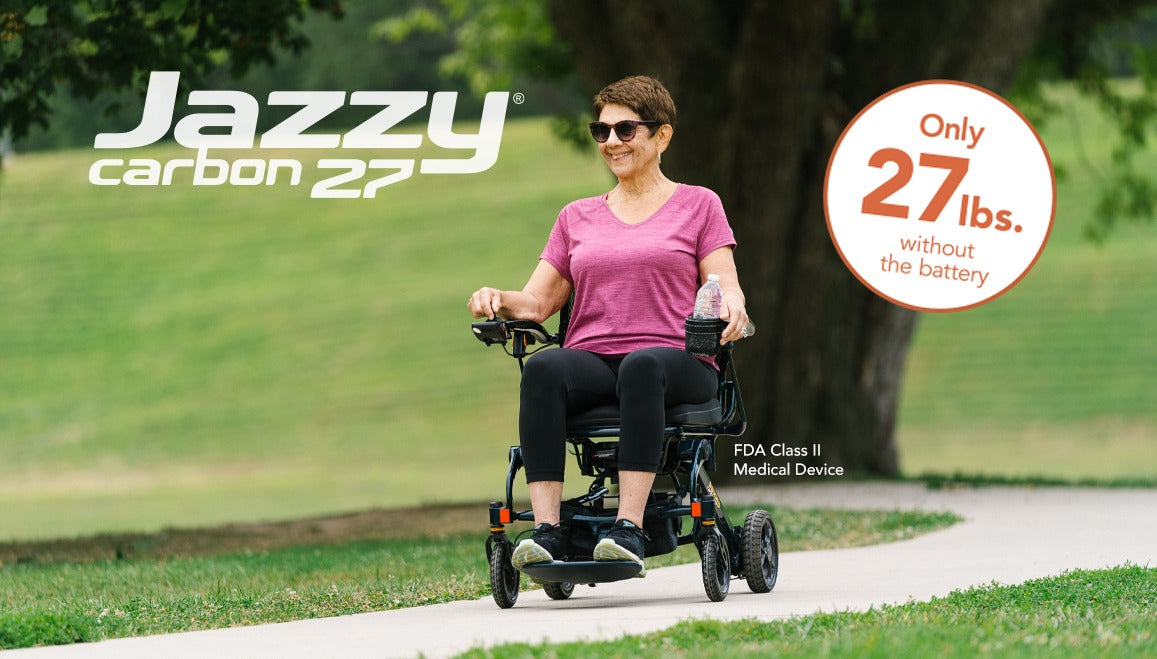 Woman using a Jazzy carbon 27 scooter outdoors with promotional text.